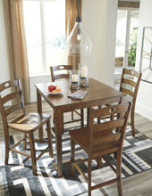 Hazelteen Counter Height Dining Room Table and Bar Stools (Set of 5)